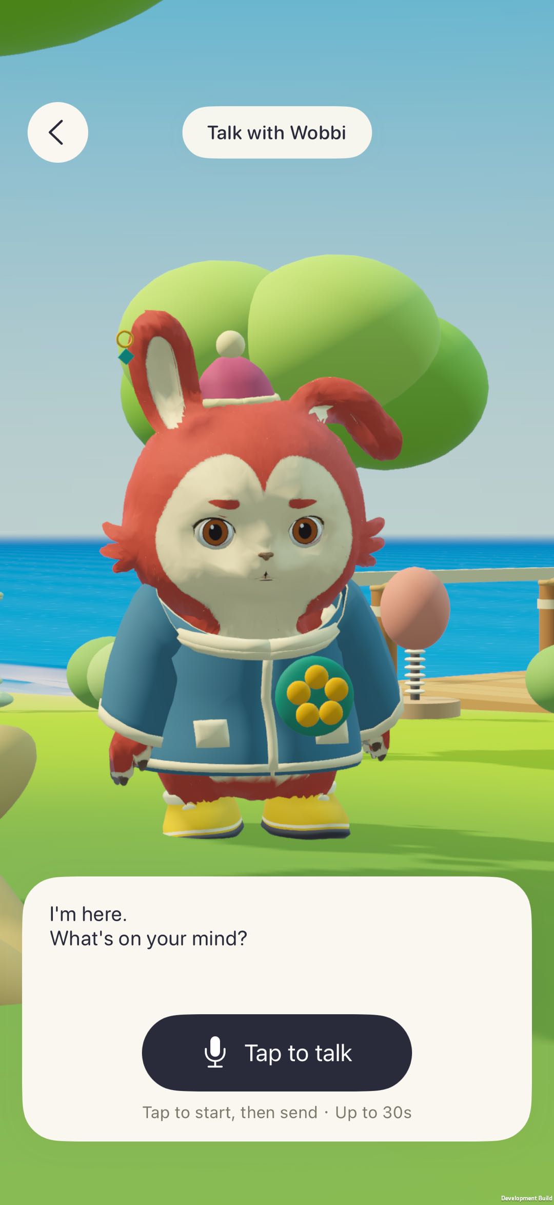 Wobbi in a blue coat, with the real Talk with Wobbi voice conversation interface